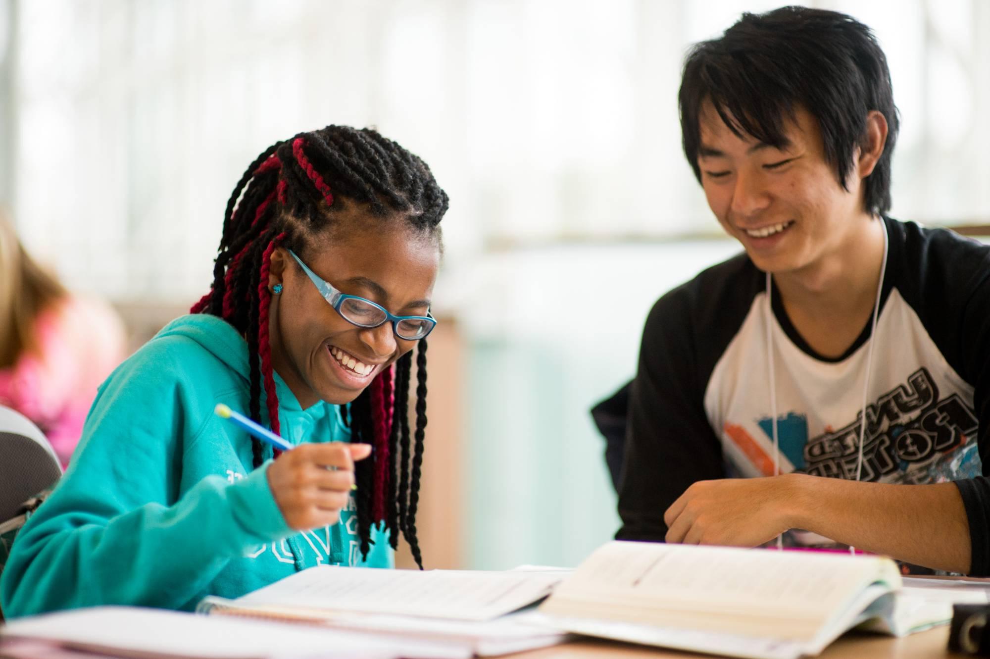 Smiling students studying